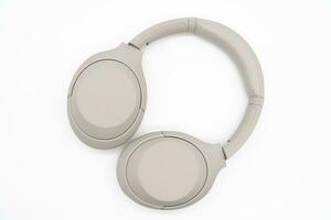 Wireless Silver headphones background on isolated background. With Noise Cancelling and Integrated Microphone. photo