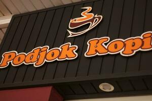 Logo and emblem of the podjok kopi, a hangout and coffee shop. photo