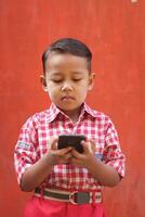 Magelang 10 03 2023 -boys wear school uniforms and carry cellphones photo