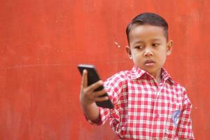 Magelang 10 03 2023 -boys wear school uniforms and carry cellphones photo