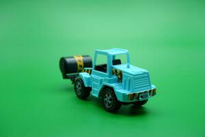 tandem roller toy in blue color isolated on green background. photo