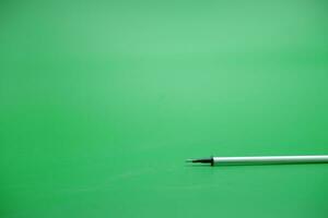 pen refill isolated green background photo