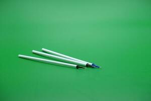 pen refill isolated green background photo