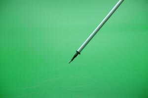 pen refill isolated green background photo