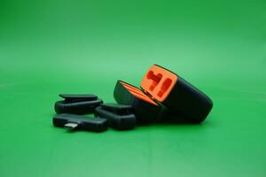 wireless mic with its charging case on a green background photo