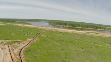 Flying over the military trucks crossing the bridge video