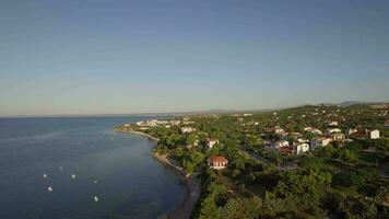 Coastal town scene with blue sea Aerial view of Trikorfo Beach, Greece video