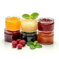Variety of fruit jams and jellies on a white background photo
