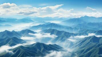 Hazy mountains seen through wispy clouds photo
