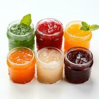 Variety of fruit jams and jellies on a white background photo