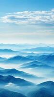 Hazy mountains seen through wispy clouds photo