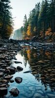 Blurred river with rocks and trees in foreground photo