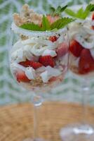 a dessert with strawberry in a glass photo