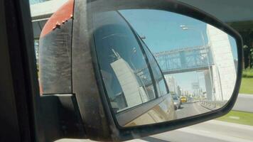 City and traffic view in reflection of car side mirror video