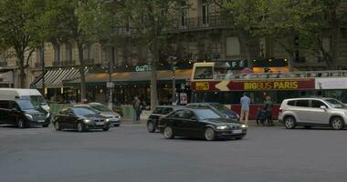 Car and people traffic in the street of Paris video