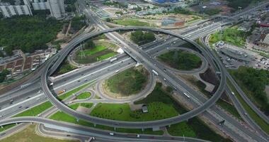 Aerial view of transport interchanges with roundabout traffic video