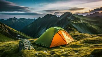 Camping in the mountains at sunset. The concept of active tourism photo