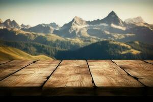 Wooden table background against mountain range in the clouds, with copy space photo