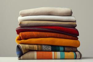 Stack of blankets. Stack of autumn sweaters. Generative Ai photo