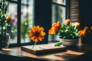 orange flower on a wooden table in front of a window. AI-Generated photo