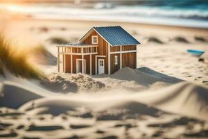 a miniature house sits on the sand at the beach. AI-Generated photo
