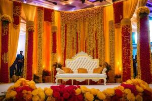 a wedding stage decorated with yellow and red flowers. AI-Generated photo