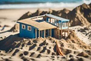 un miniatura casa en el playa con arena. generado por ai foto
