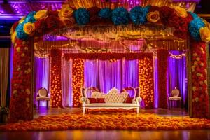 an indian wedding stage decorated with colorful flowers. AI-Generated photo