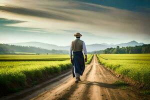 un hombre caminando abajo un suciedad la carretera en un campo. generado por ai foto