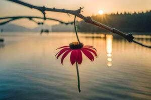 a red flower hanging from a branch over a lake. AI-Generated photo