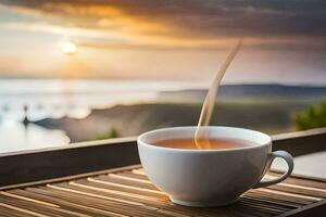 un taza de té en un de madera mesa con un ver de el mar. generado por ai foto