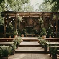 Rustic outdoor celebration with wooden accents and greenery backdrop photo