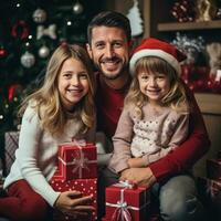 Happy family in Santa hats with gifts and decorations photo