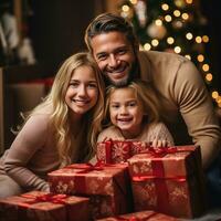 Happy family in Santa hats with gifts and decorations photo