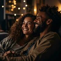 Woman cuddles with man while watching a movie. photo