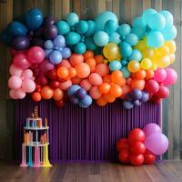 Vibrant rainbow balloon backdrop with tassels photo