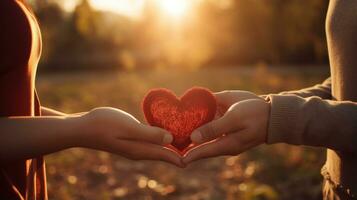 Close-up of couple's hands forming a heart shape. photo