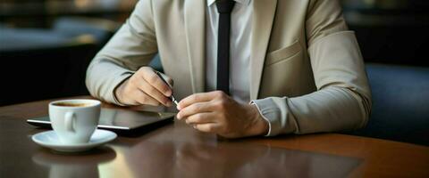 Young businessman at a morning cafe with laptop and coffee AI Generated photo