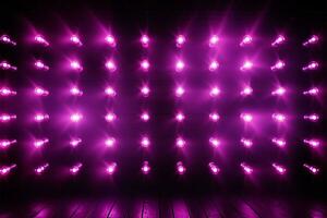 Wall adorned with bright purple LED lamps, creating an incandescent atmosphere AI Generated photo