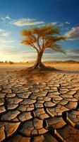 Tree stands in cracked earth, depicting climate crisis, water scarcity from global warming Vertical Mobile Wallpaper AI Generated photo