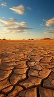 Earths struggle Cracked desert soil mirrors climate changes toll on parched land Vertical Mobile Wallpaper AI Generated photo