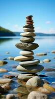 Nautical formation Sea kissed stones stacked into a pyramid along the shore Vertical Mobile Wallpaper AI Generated photo
