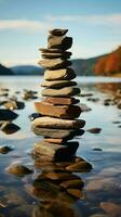 Shoreline homage Stacked stones create a pyramid on the coastal edge, overlooking waves Vertical Mobile Wallpaper AI Generated photo