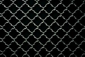 Grid of chain link mesh fence against a black backdrop AI Generated photo