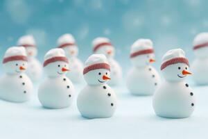 A festive group of snowmen wearing hats and scarves photo