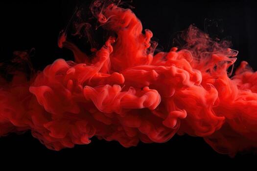red smoke floating in the air on a black background photo