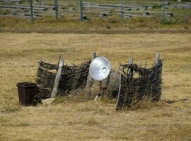 lamp with a searchlight on the lawn for lighting a high object. photo