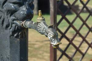 Water tap in the form of a pike photo