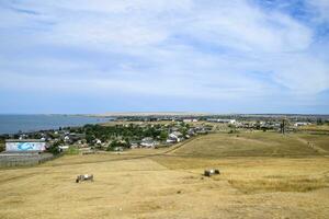 The landscape at the Cossack village - a museum Ataman. the village and the sea view from the heights of the hill. photo