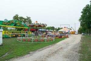 Circus in the park. Established circus rides in the city park. photo